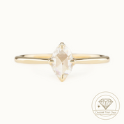 An oval rose-cut diamond ring with a gold band, set in a white gold band with a high profile four prongs flower setting, presented on a white background with a 'Choose Your Own' diamond logo in the corner.