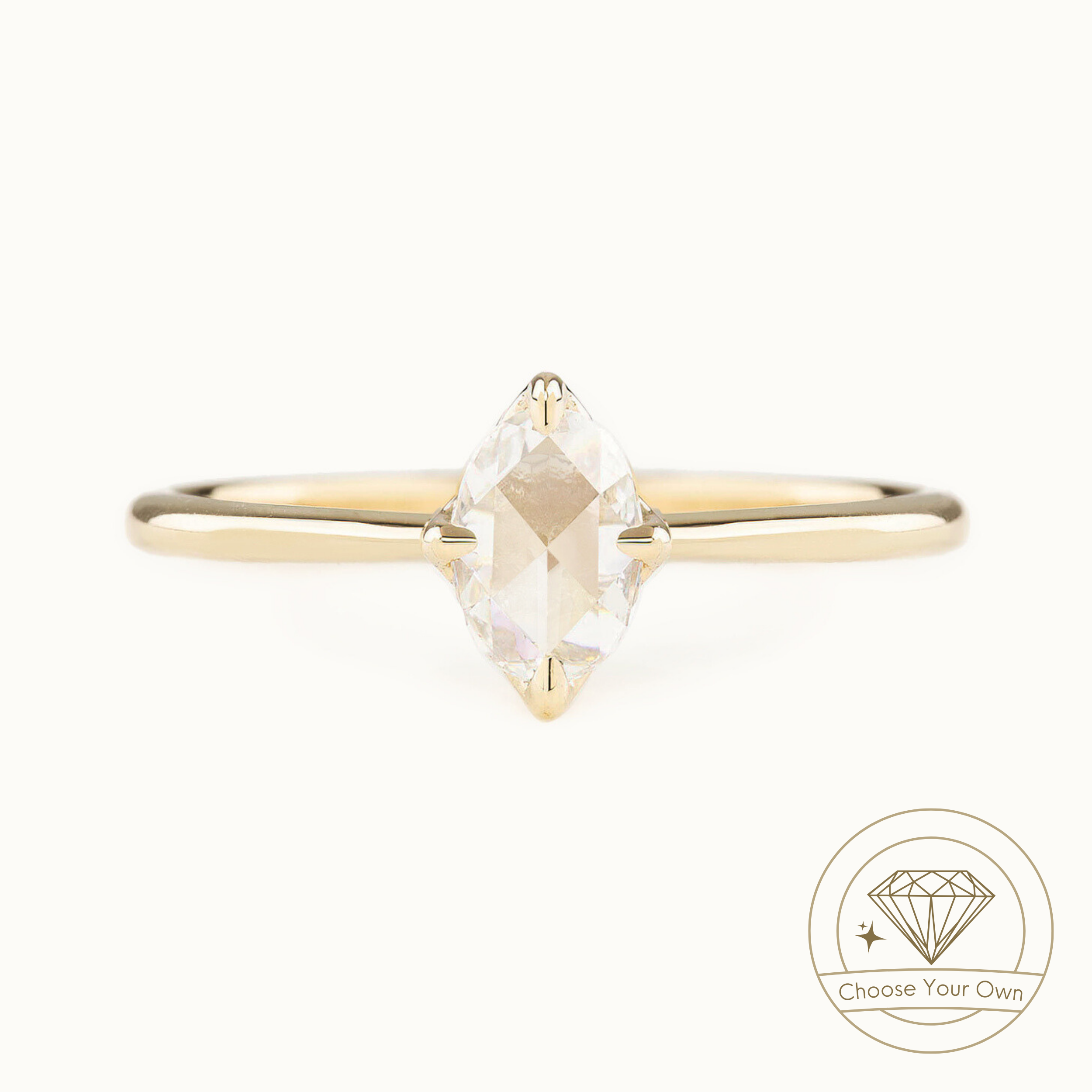 An oval rose-cut diamond ring with a gold band, set in a white gold band with a high profile four prongs flower setting, presented on a white background with a 'Choose Your Own' diamond logo in the corner.