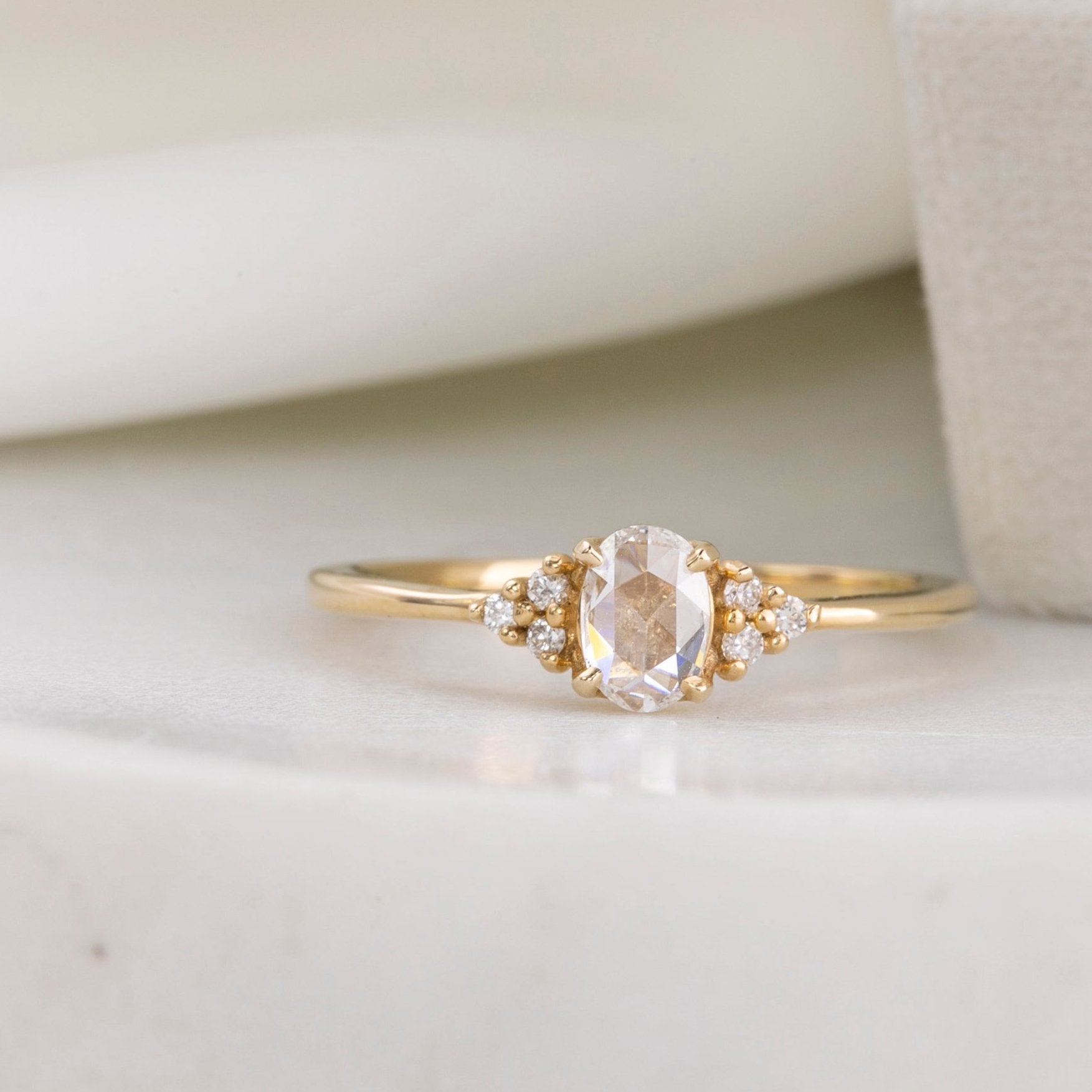 14k yellow gold Teresa ring with 0.45ct oval rose cut diamond and white accent diamonds in flower setting
