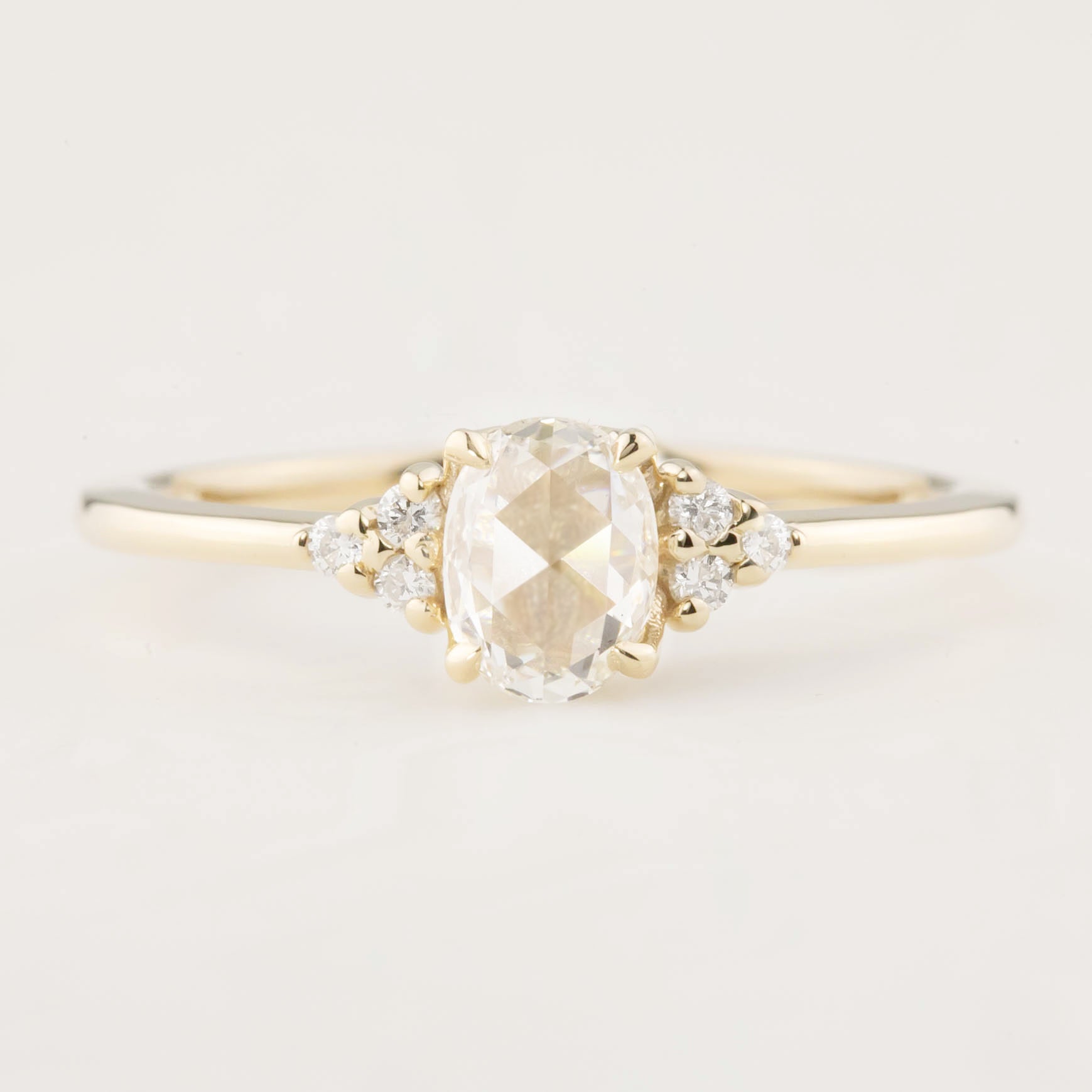Oval rose cut 0.45ct diamond ring in 14k yellow gold with white accent diamonds in flower setting