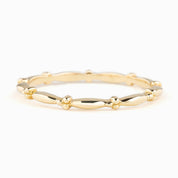 Julia Ring solid gold full eternity bead band with 1.7mm width, ethically sourced, in recyclable kraft box.