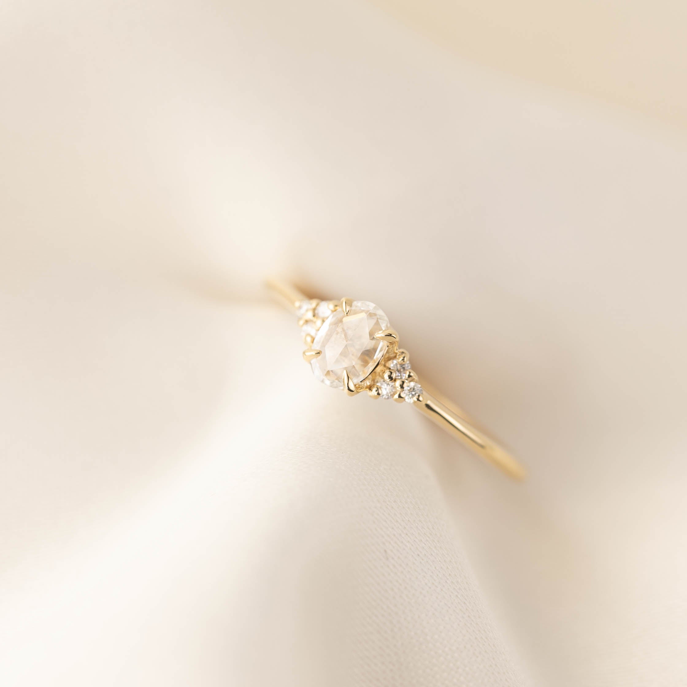 14k yellow gold Teresa Ring with 0.45ct oval rose cut diamond and small white accent diamonds on tapered band