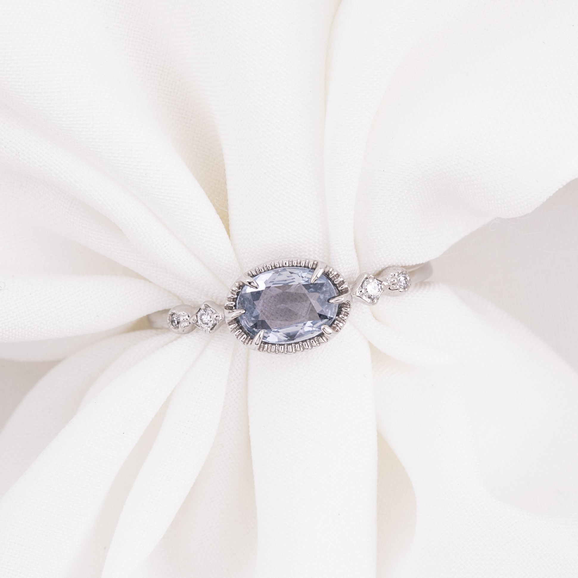 One of a kind Stella ring with 0.80ct unheated blue sapphire and 14k white gold band with accent diamonds
