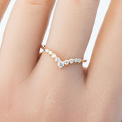 Lily's Tiara Ring with natural white diamonds in an ethically sourced solid gold band, worn on a hand.