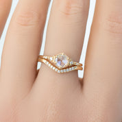 Close-up of Esperanza Ring featuring natural white diamonds in a 1.5mm solid gold band on a finger