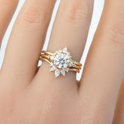 Gloria Ring featuring natural white diamonds in a delicate, ethically sourced gold setting on a hand.