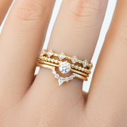 Bella's Crown Ring stacked with delicate gold bands featuring natural white diamonds, handmade and ethically sourced jewelry.