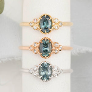 3 Celine Ring featuring a 0.60ct blue Montana sapphire in a 14k yellow, rose and white gold with six natural diamond accents