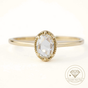 Oval rose cut diamond ring with six prong decorative bezel set on a slim recycled gold band in velvet box