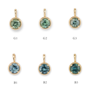 Six gold pendants with green gemstones on a white background