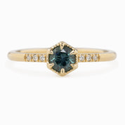 Hexagon ring with a teal blue sapphire and natural diamond accents in 14k yellow gold 