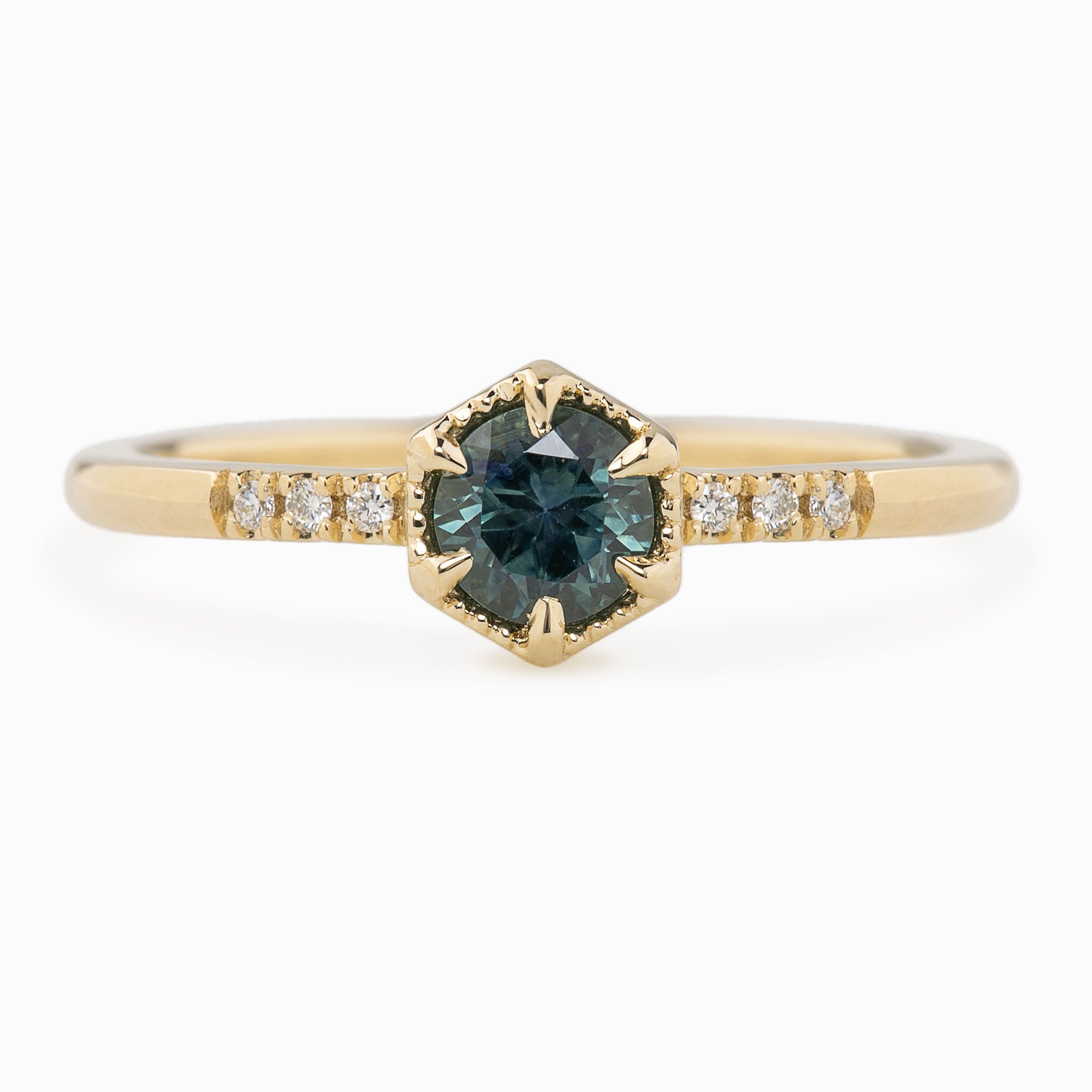 Hexagon ring with a teal blue sapphire and natural diamond accents in 14k yellow gold 