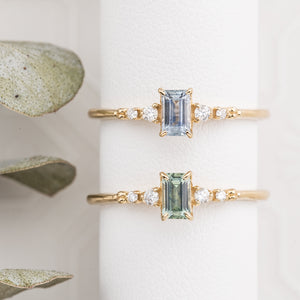 Two Estel Fleur Ring featuring a 0.45ct emerald cut Montana sapphire in 14k yellow gold