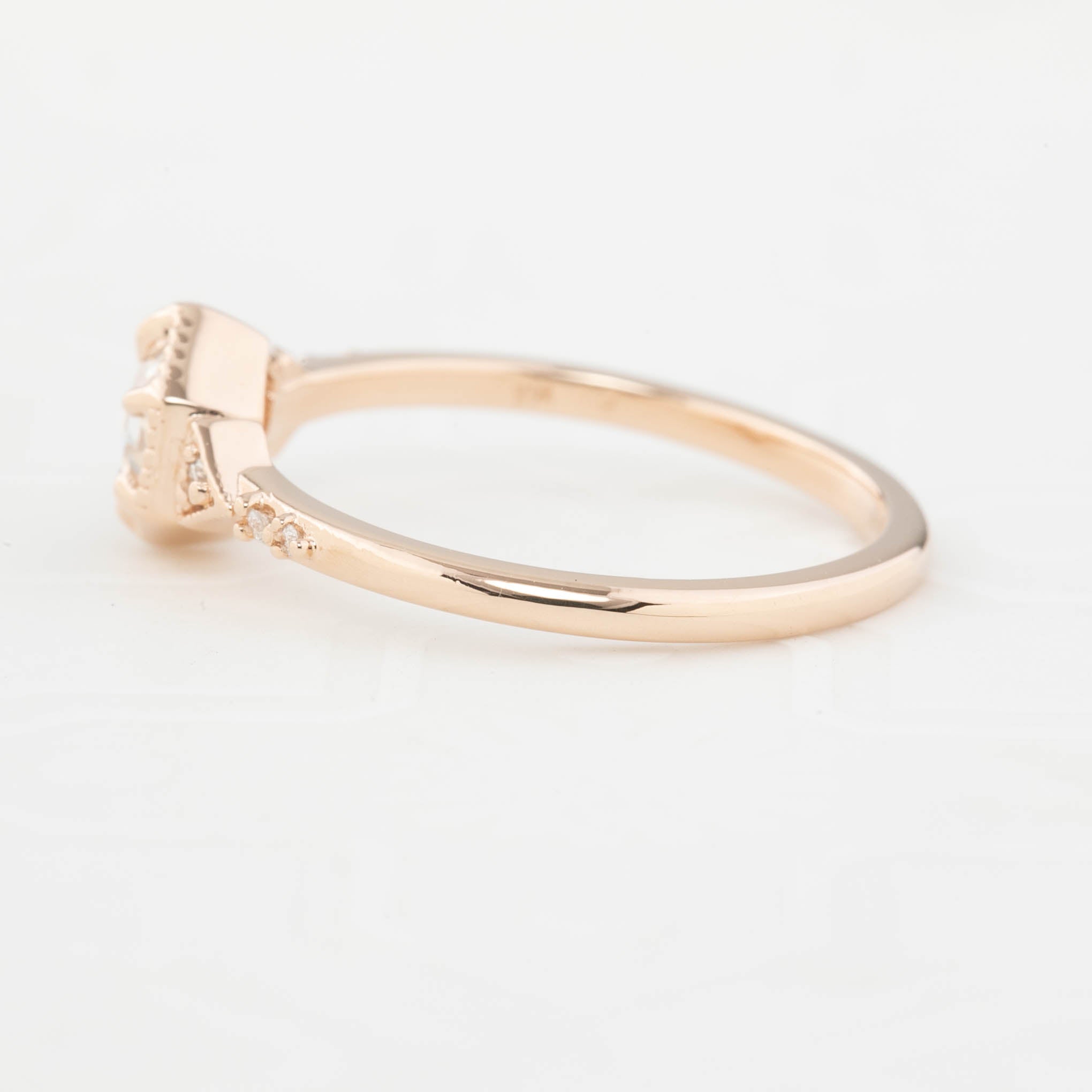 Side view of the art Deco-inspired 14k rose gold featuring a 0.45ct round rose cut diamond