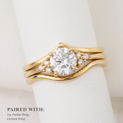 Gold ring with diamond on a white background