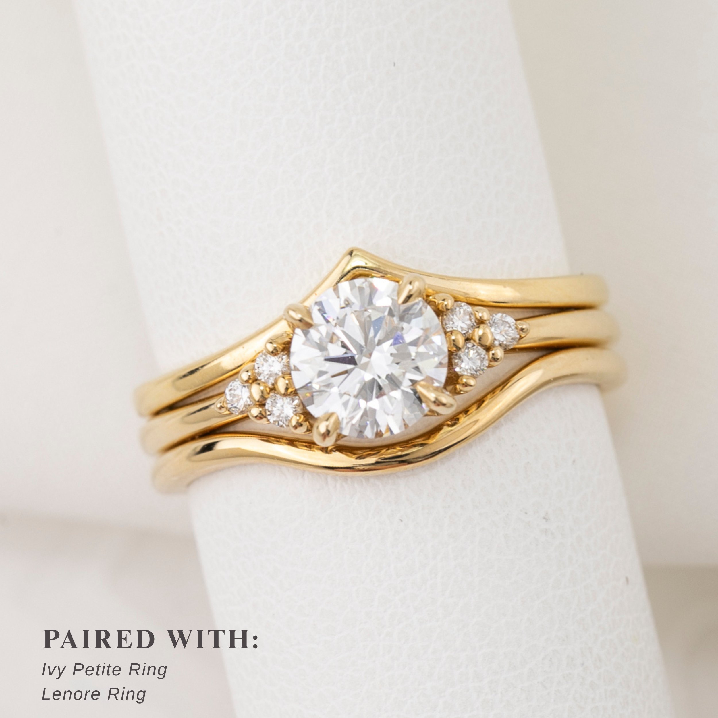 Gold ring with diamond on a white background