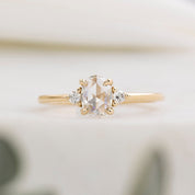 Gold ring with a diamond on a blurred background