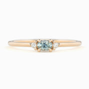 Emilie Ring featuring a 0.20ct East-West set oval Montana sapphire in 14k rose gold.