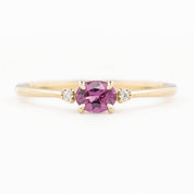 Emilie Ring featuring a pink 0.45ct East-West unheated Umba sapphire in 14k yellow gold.