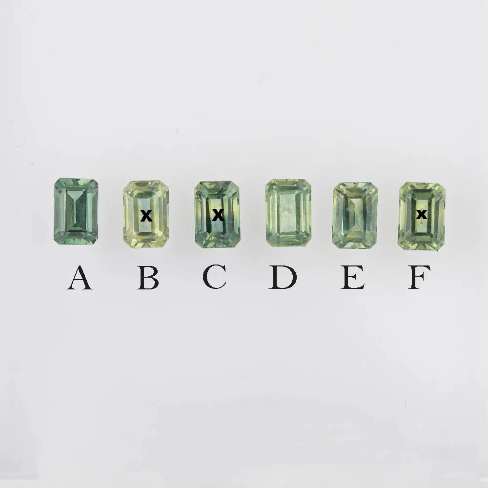 Six emerald-cut green gemstones labeled A to F on a light gray background