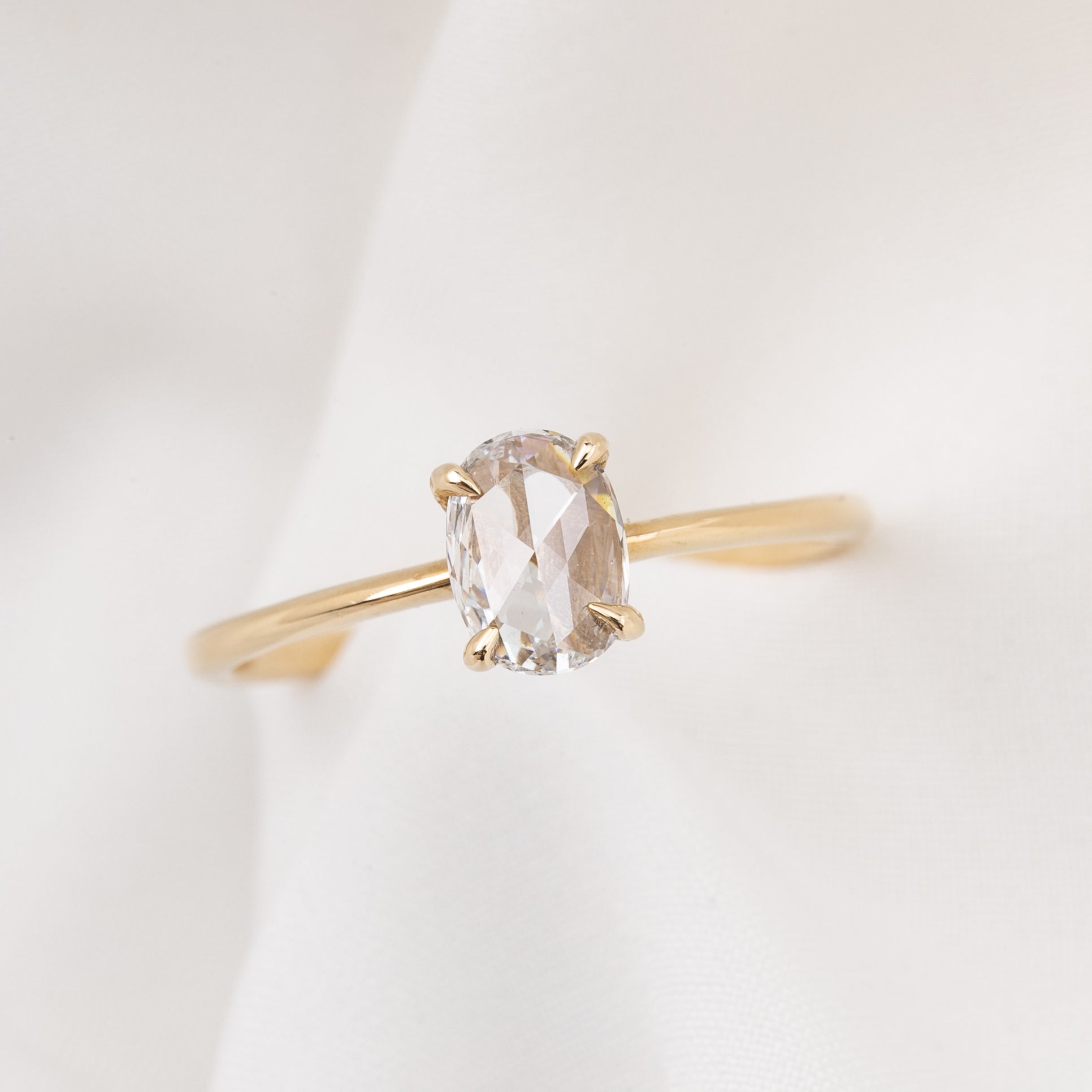 Nina Ring featuring a 0.48ct oval rose-cut diamond set in recycled 14k yellow gold, handmade and one of a kind.