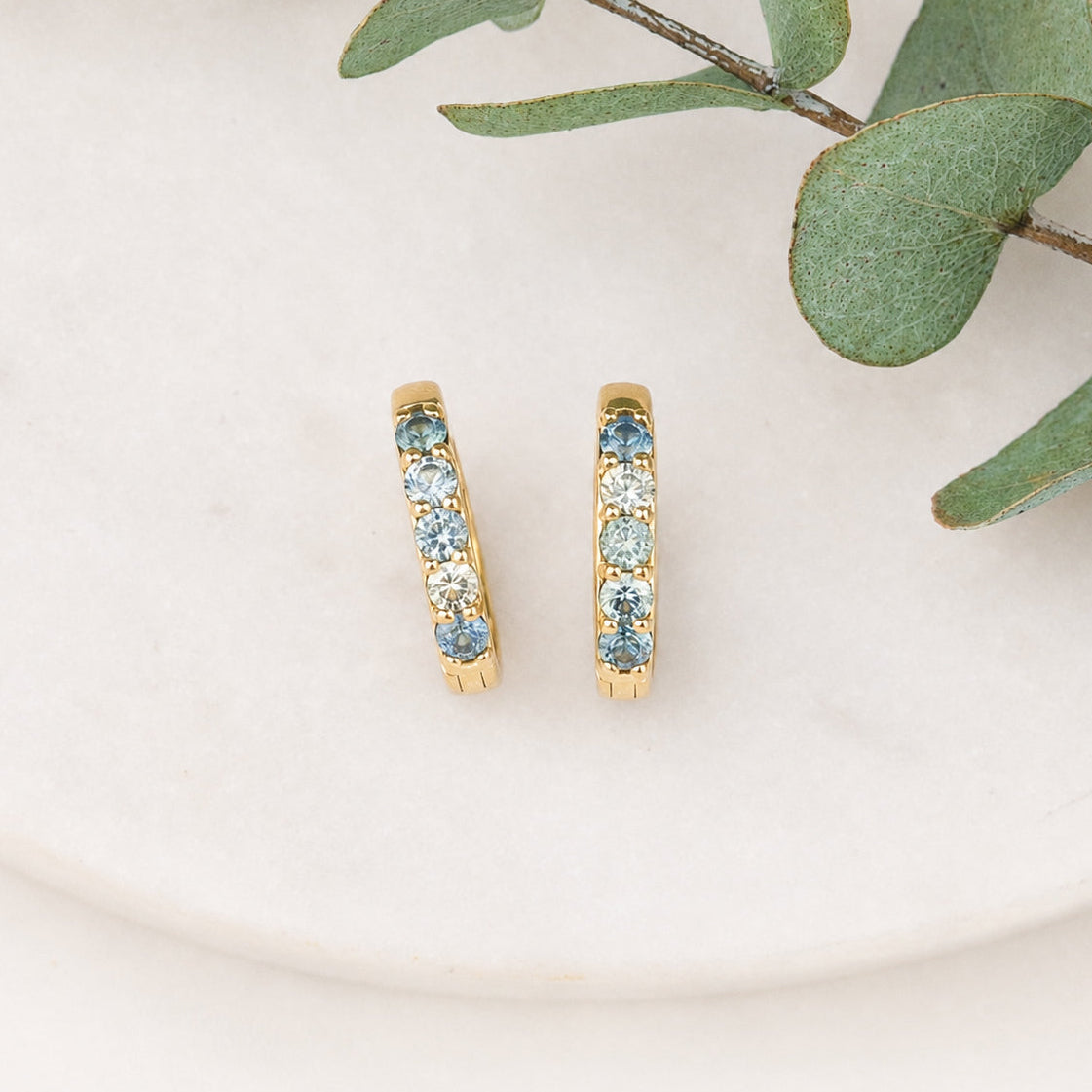 14K yellow gold Montana sapphire huggie earrings with blue sapphires, 12.5mm