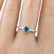 Estel Fleur Ring, 0.72ct Dark Blue Montana Sapphire