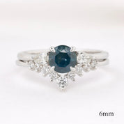 Lily's Tiara Ring with a natural blue gemstone and white diamonds, authentic and ethically sourced solid gold band.