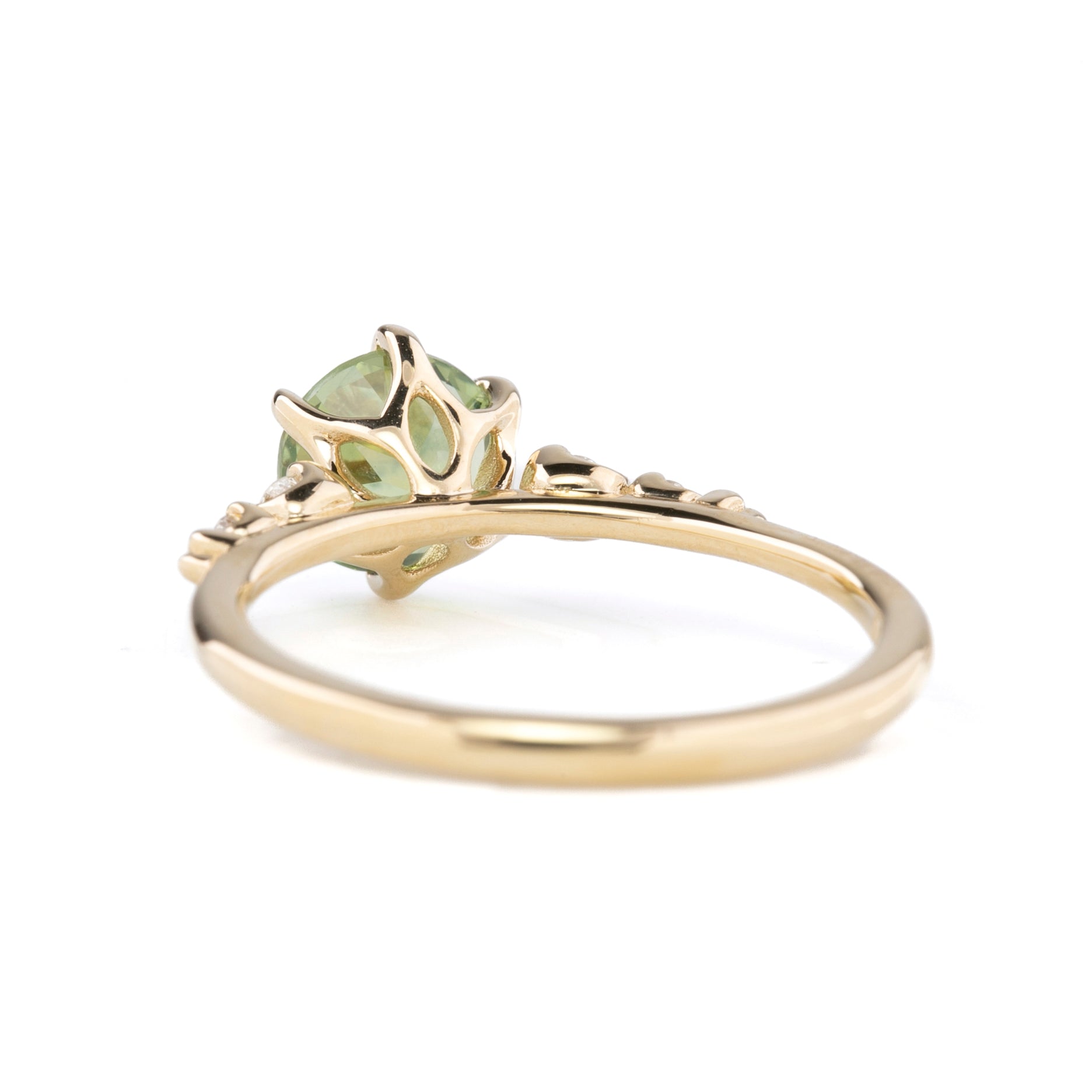 Back view of Estel Fleur Petal Ring with a 1.53ct round green Montana sapphire and diamond accents in 14k yellow gold.