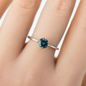 Alice Ring, 0.85ct Queensland Sapphire ring with a green gemstone on a white background
