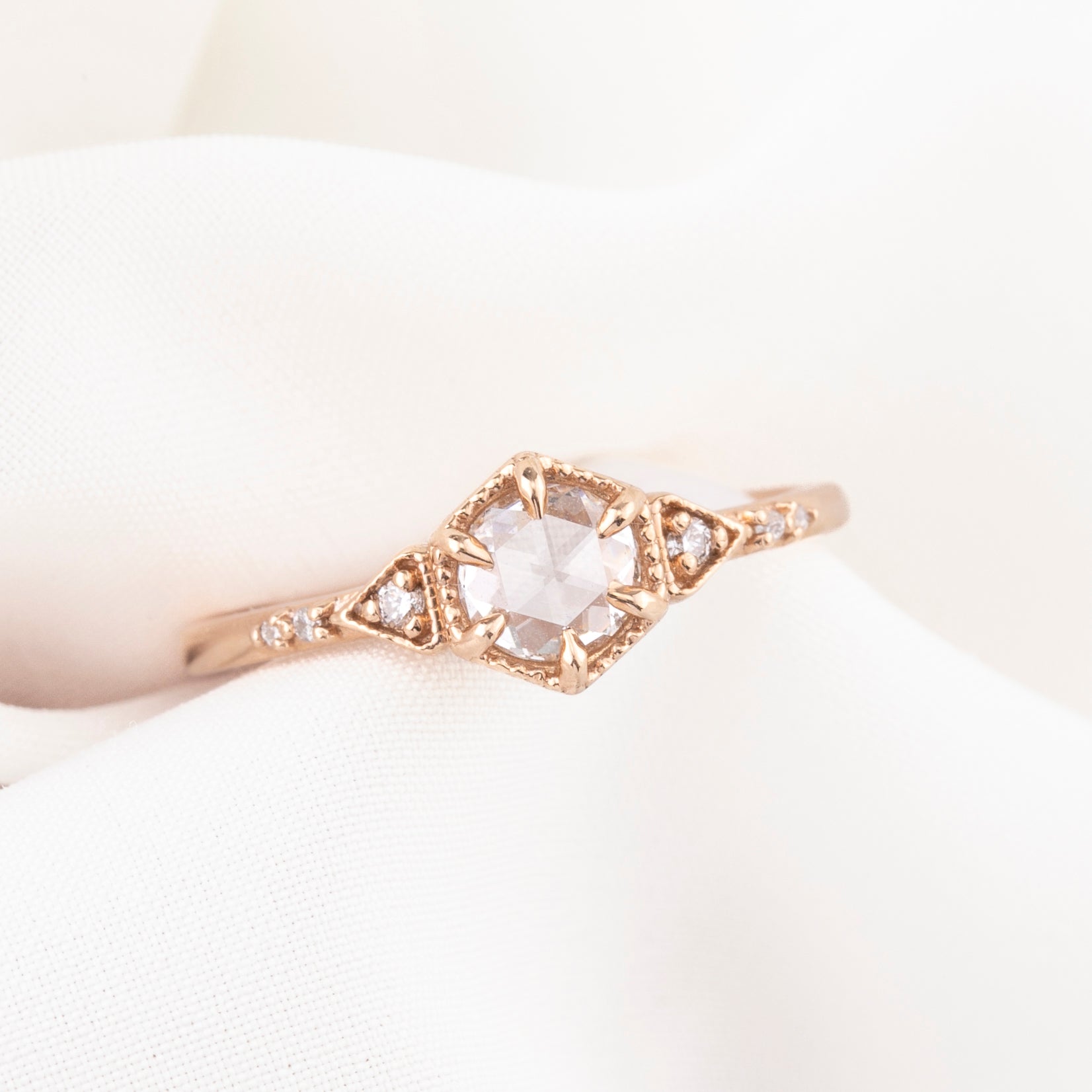 Art Deco-inspired 14k rose gold featuring a 0.45ct round rose cut diamond