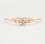 Estel Ring featuring a 0.20ct light blue unheated oval sapphire and 14k rose gold diamond accents