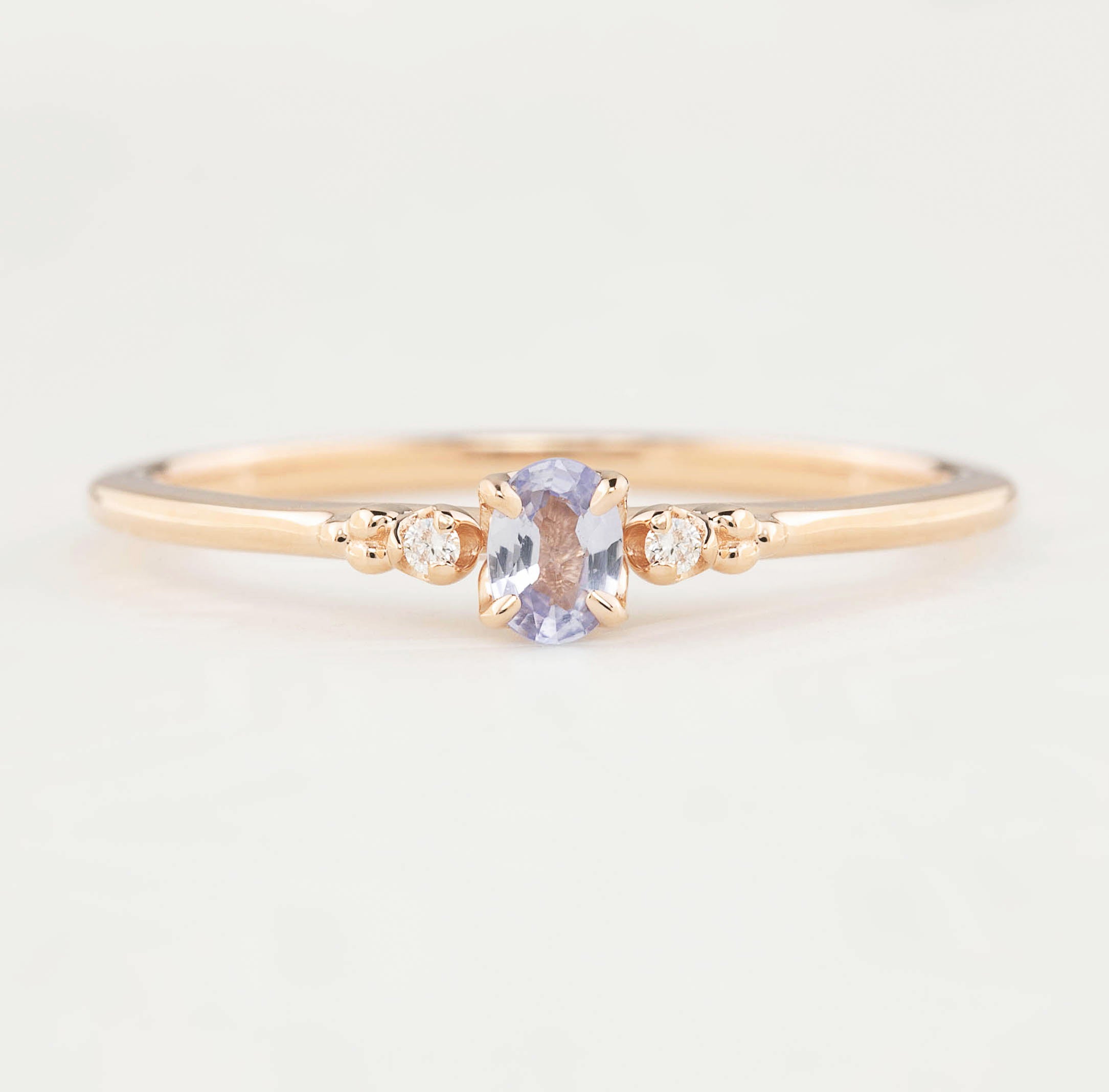 Estel Ring featuring a 0.20ct light blue unheated oval sapphire and 14k rose gold diamond accents
