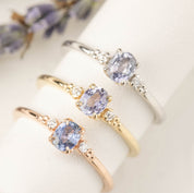 Three Estel Ring featuring a 0.40ct light blue unheated oval sapphire and 14k gold diamond accents