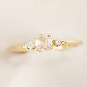 Estel ring with 0.30ct rose cut diamond and white accent diamonds in 14k yellow and white gold band