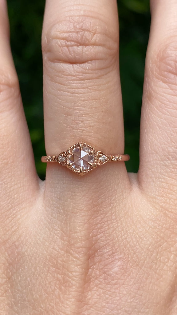 Video of an art Deco-inspired 14k rose gold featuring a 0.45ct round rose cut diamond worn on a finger