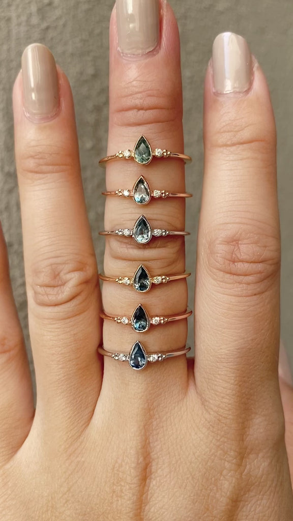 Six Estel Bezel Ring with a 0.35ct unheated teardrop sapphire and two natural diamond accents in 14k gold.