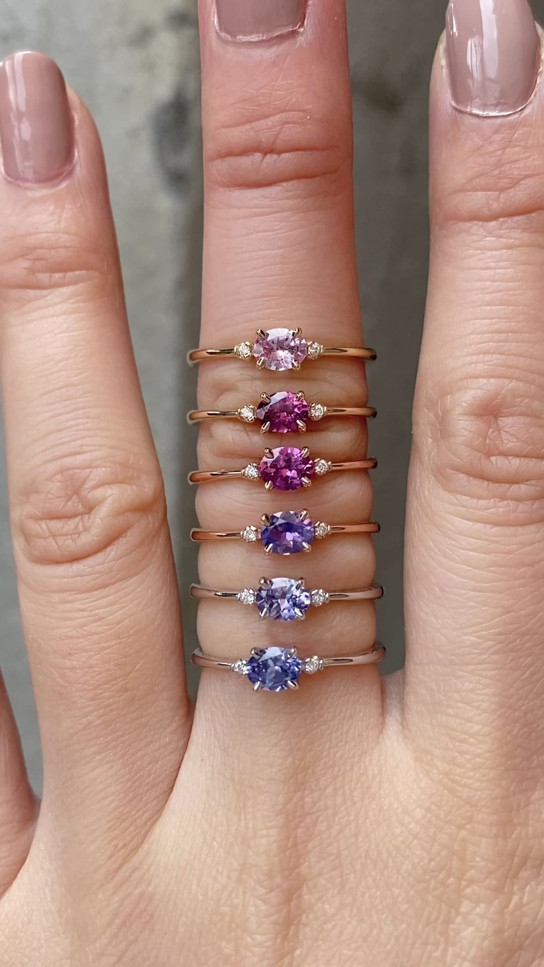 Six Emilie 0.45ct Umba sapphire ring worn to show the unique horizontal orientation  in different materials worn on finger.