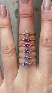 Six Emilie 0.45ct Umba sapphire ring worn to show the unique horizontal orientation  in different materials worn on finger.