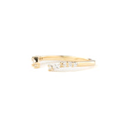 Gold ring with small diamonds on a white background
