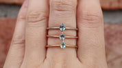 Alice Ring, 0.20ct Unheated Sapphire ring in 14k yellow gold, rose gold and white gold on a finger.