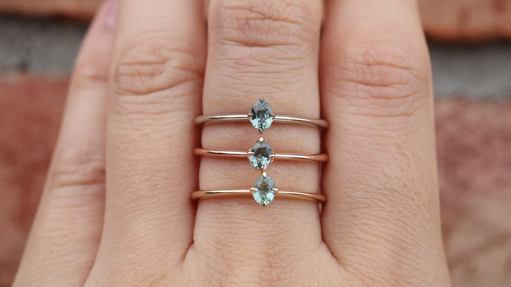 Alice Ring, 0.20ct Unheated Sapphire ring in 14k yellow gold, rose gold and white gold on a finger.