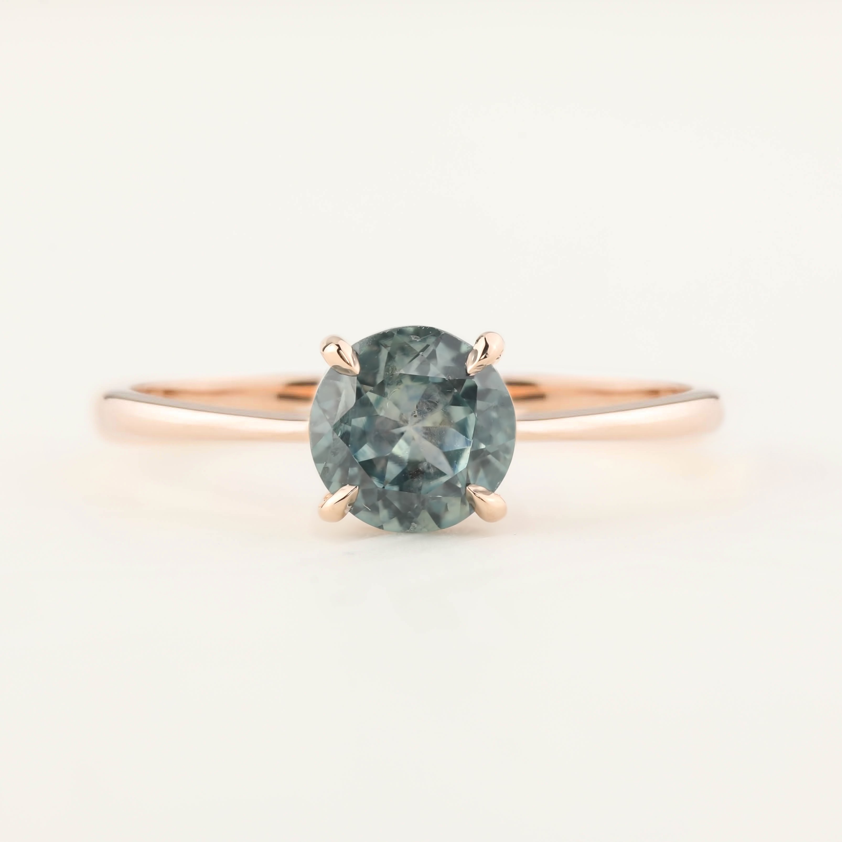 Close-up of Nina Ring with 0.98ct light green Montana sapphire set in 14k rose gold tapered band