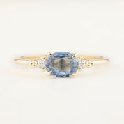 Unique Estel ring with 0.97ct blue sapphire and small white diamonds set in recycled 14k gold band