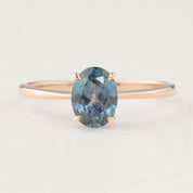 14k rose gold ring with 1.24ct teal blue Montana sapphire in a classic four-prong setting, size US7 adjustable.