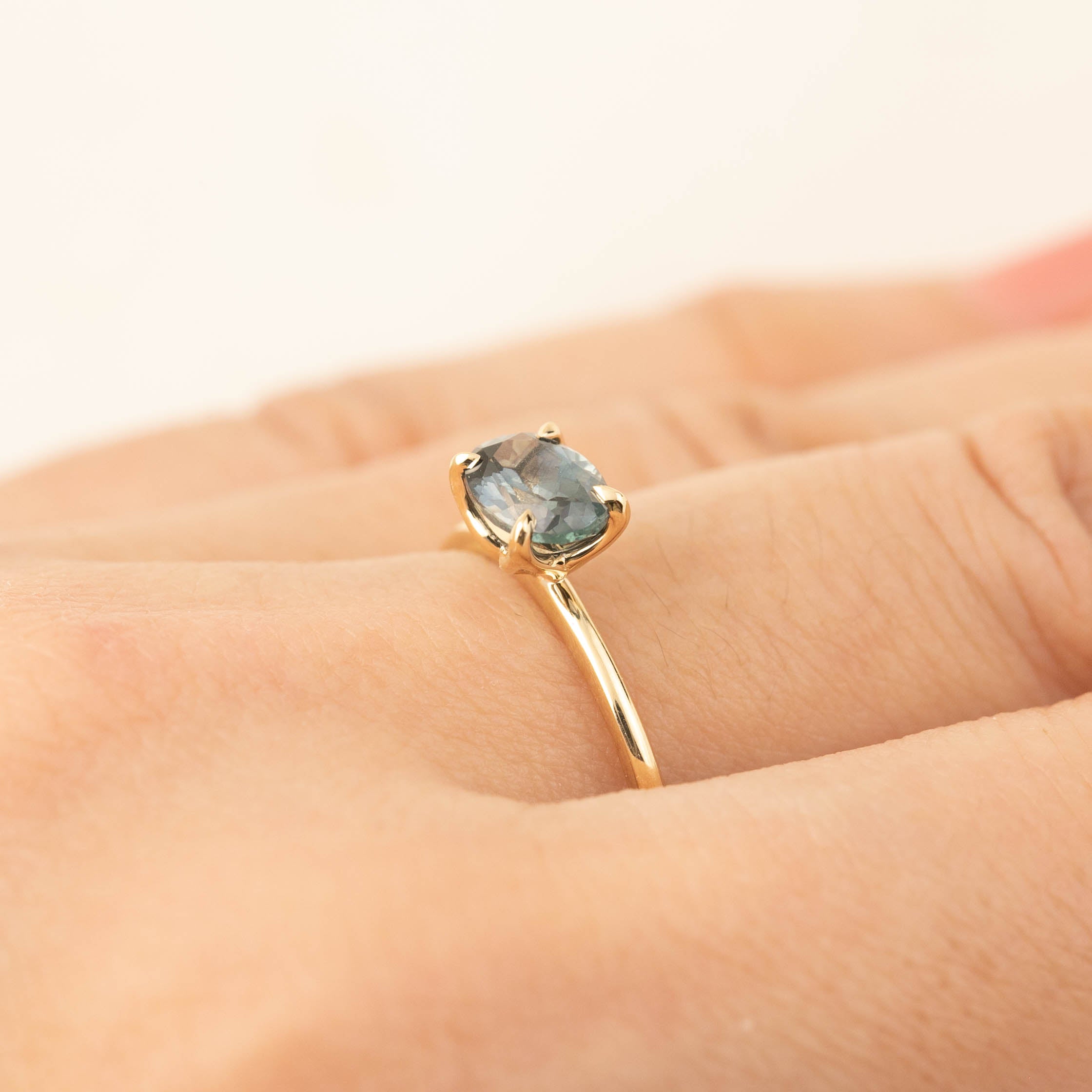 Sara Ring with 1.12ct blue green Montana sapphire set in 14k recycled yellow gold with tapered band