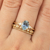 Close-up of Estel Ring featuring 1.62ct teal Montana sapphire with diamond accents on recycled 14k gold band