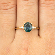 One of a kind 1.56ct teal blue Montana sapphire ring with white diamond accents in recycled 14k gold band