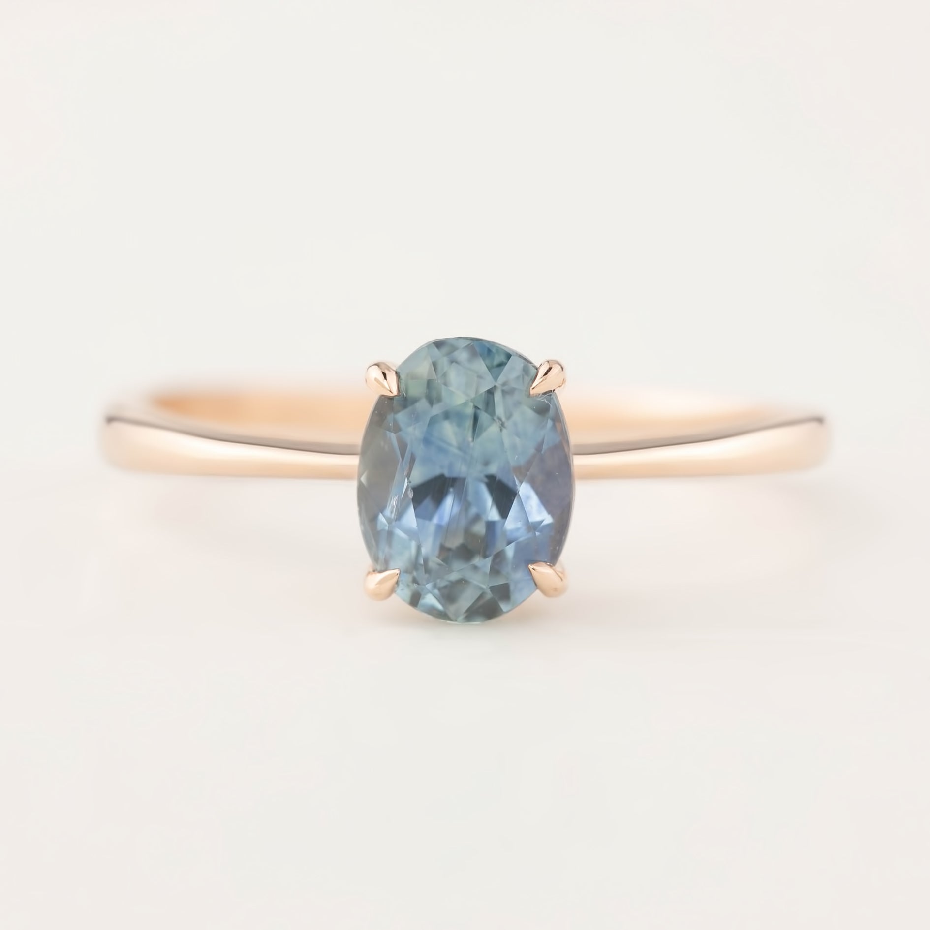 Elegant Nina Ring with 1.4ct blue Montana sapphire set in recycled 14k rose gold, size 7, four-prong setting