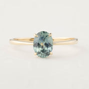 14k yellow gold ring featuring a 1.26ct oval Montana sapphire in four prong setting, size 7, resizable 3-8.5